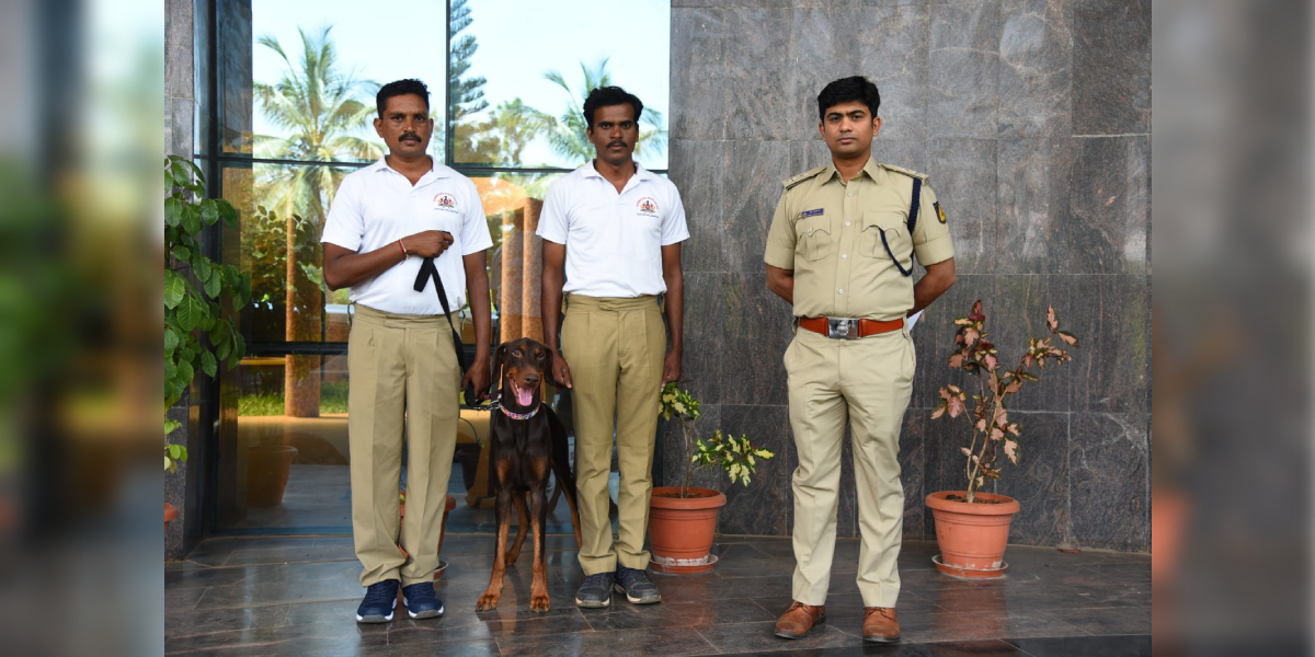 Gadag K9 Unit Rambo with his handler-trainers and the Gadag district police. (Supplied)