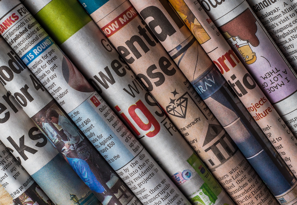 Stacked newspapers
