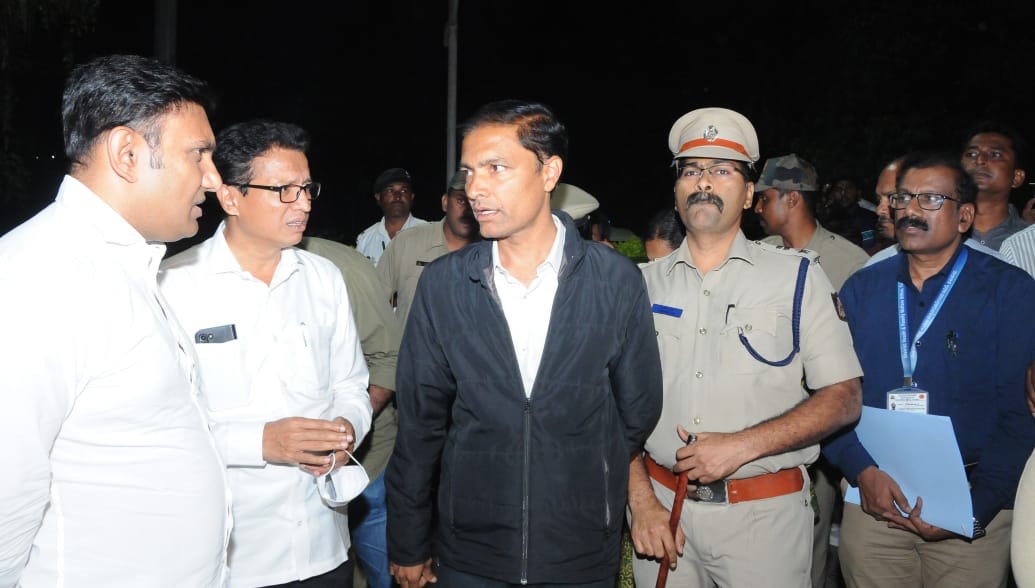 Health minister Dr K Sudhakar in Tumakuru, speaking to the authorities after a pregnant woman and her wins died.