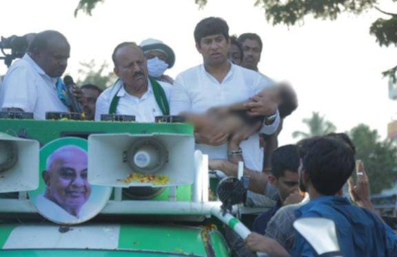 JD(S) party workers with the boy’s body on an election campaigning vehicle JD(S) party workers with the boy's body on an election campaigning vehicle