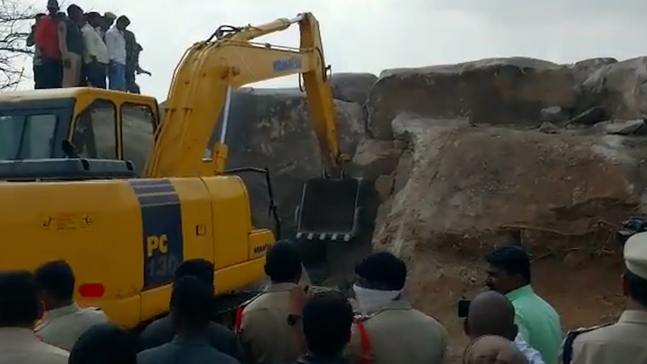 Man trapped between rocks