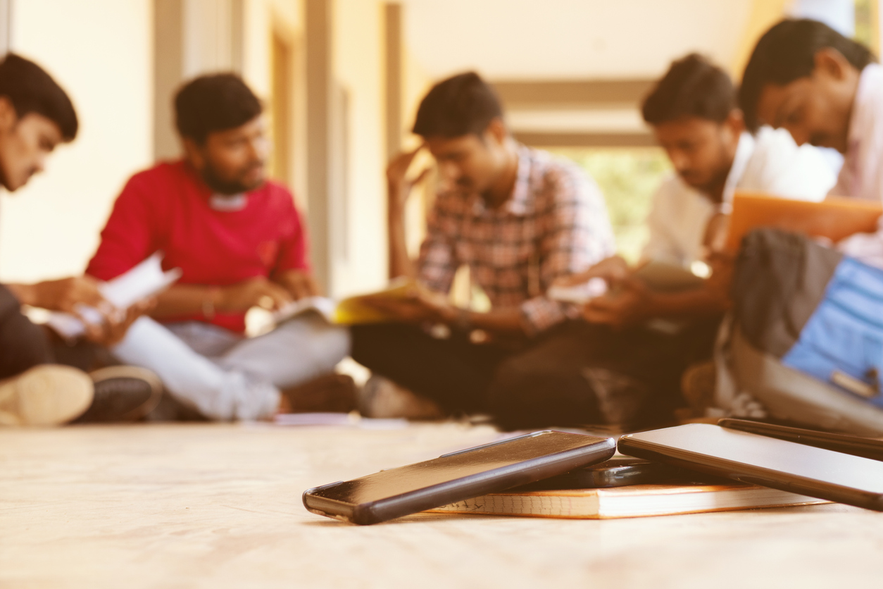 Students with mobile phones