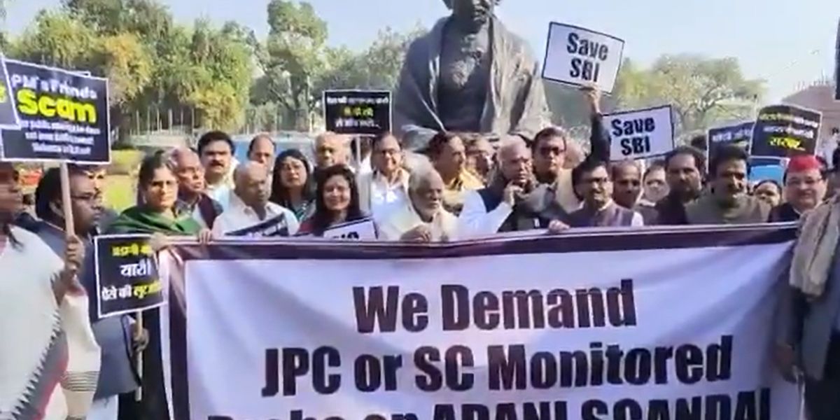 Opposition MPs protesting in front of the Gandhi statue in the Parliament demanding JPC probe over Adani issue. (Screengrab) Opposition protest Adani issue