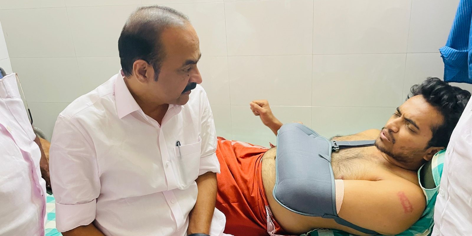 VD Satheesan with a Youth Congress worker who was injured during protests on 21 February. (VDSatheesanParavur/Facebook) Kerala Assembly protest