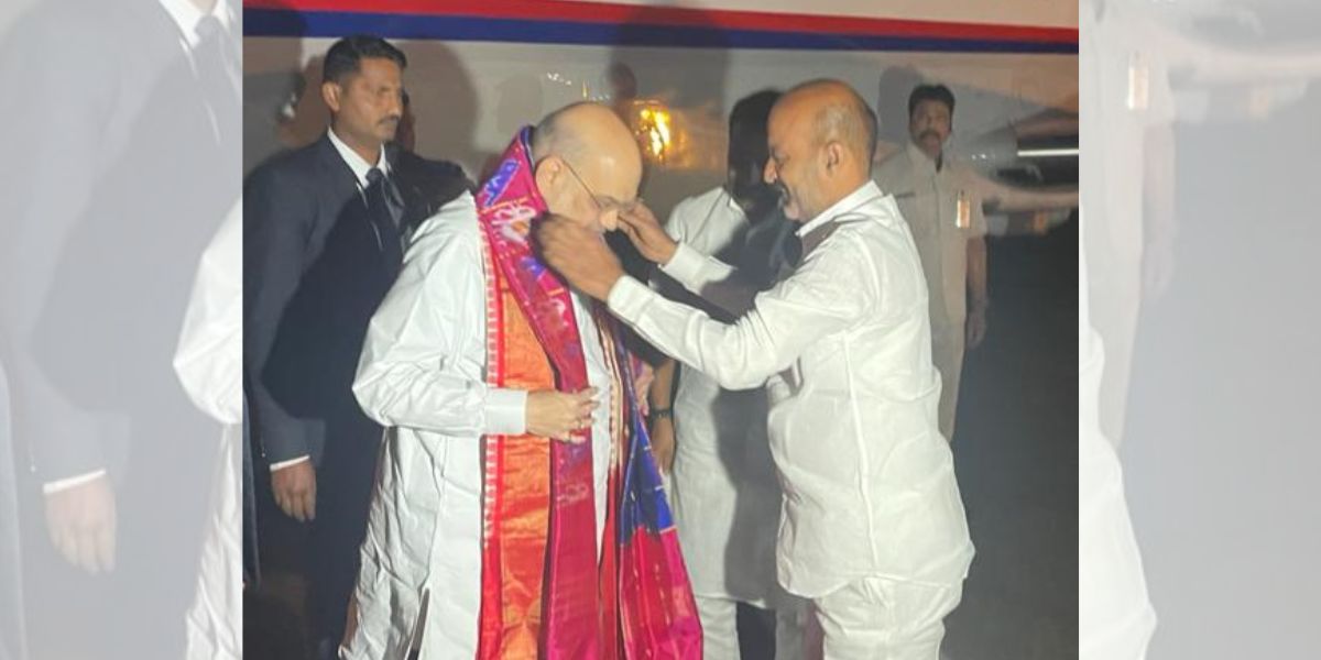 Bandi Sanjay Kumar welcoming Amit Shah at the airport. (bandisanjay_bjp/Twitter) Amit Shah Telangana BJP