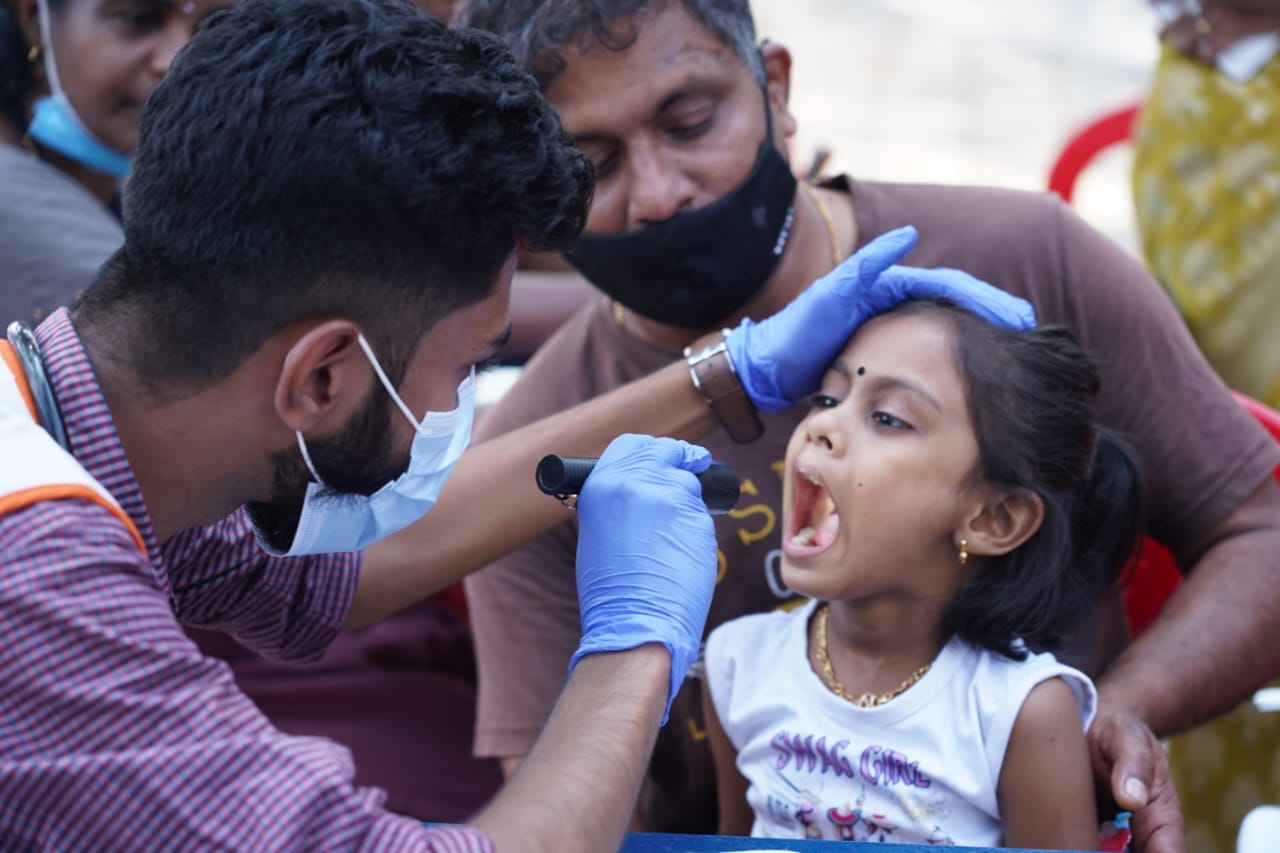 Brahmapuram1 A doctor attached to the mobile unit of the health department checks a child at Vennala, Kochi, on Monday. (Facebook/District Collector)
