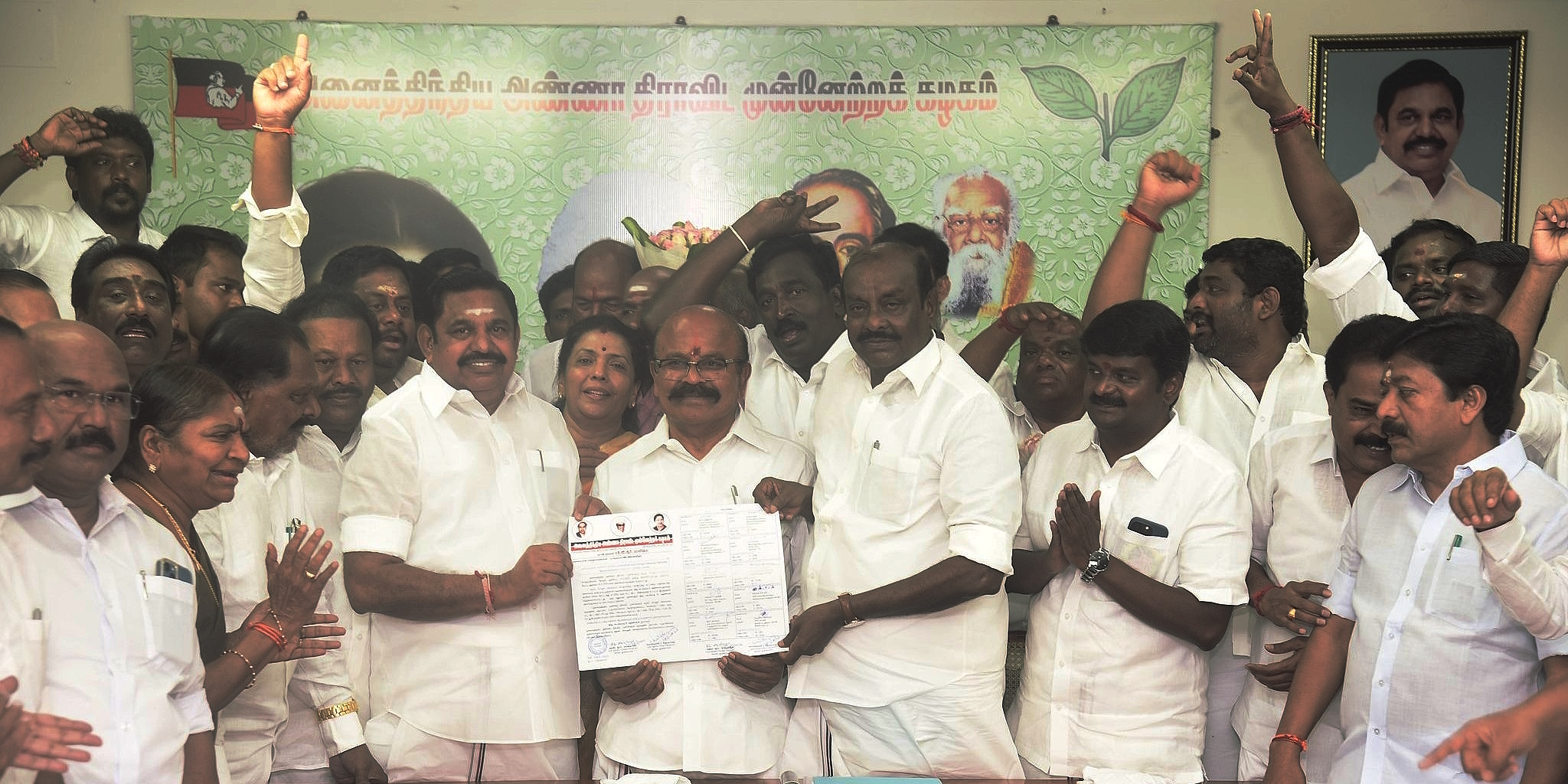 Palaniswami AIADMK election commissioners Pollachi V Jayaraman and Natham R Viswanathan hand over the winner's certificate in the general secretary elections to E Palaniswami in Chennai on Tuesday, 28 March. (Supplied)