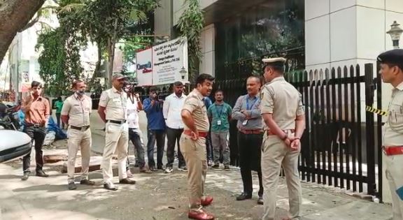 A police team in front of the victim’s office conducting inquiries on Wednesday A police team in front of the victim's office conducting inquiries on Wednesday