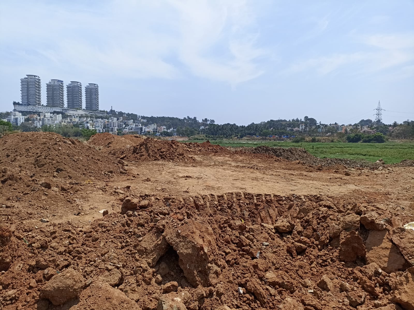 WhatsApp Image 2023-03-29 at 8.00.17 PM Hoskerehalli lake dumped with debris for muddy road