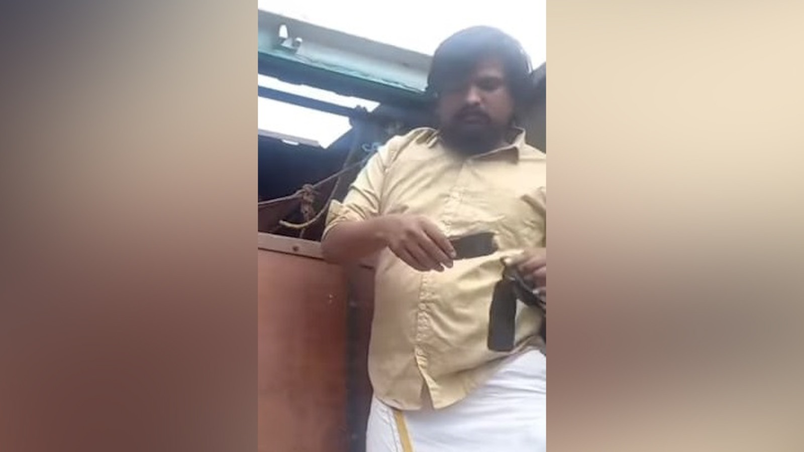 Puneeth Kerehalli with his taser stun gun at Electronic City toll plaza on March 20th.