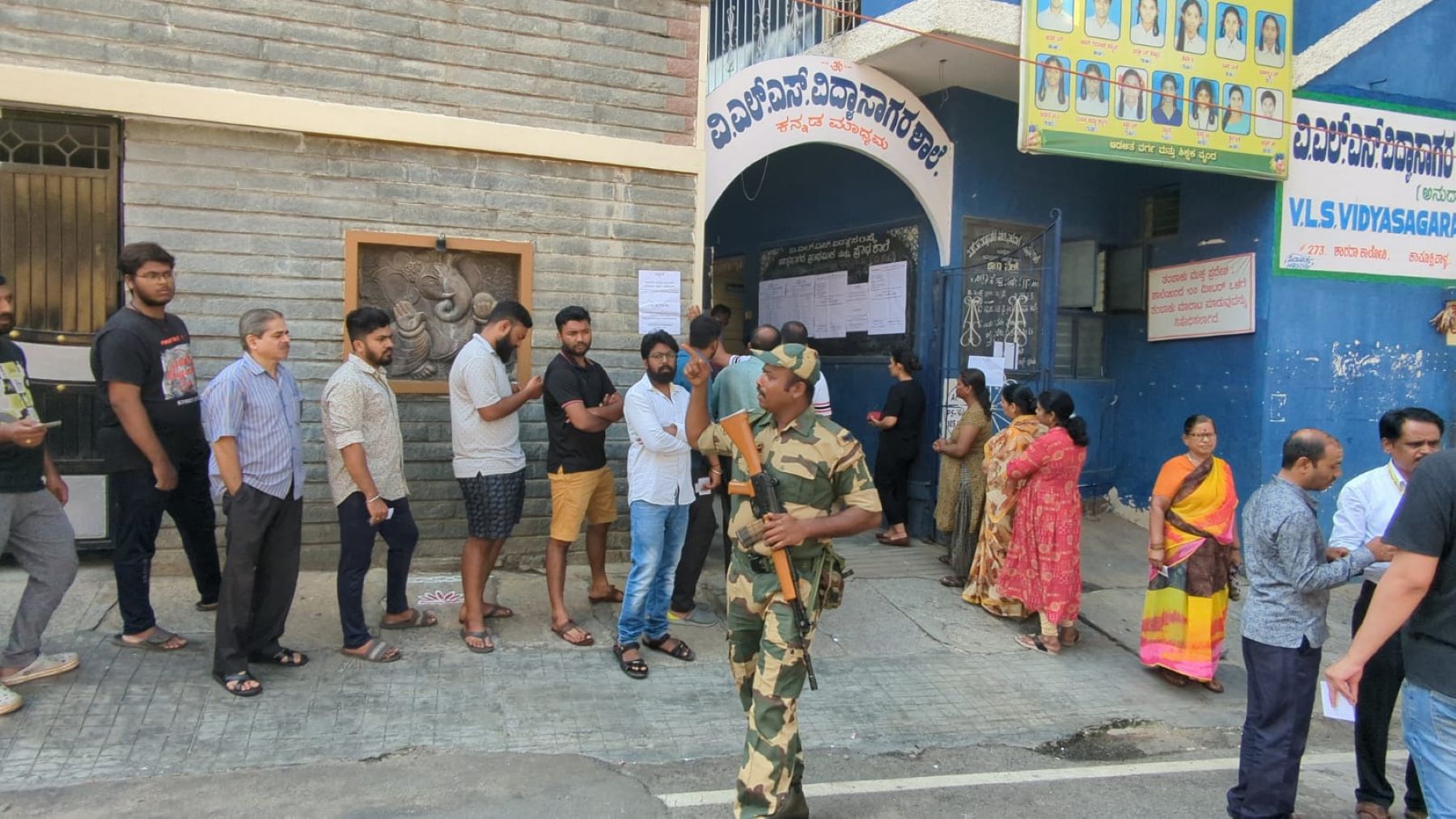 polling Blore Karnataka Elections: Voters standing in line outside the polling station in Basavaeshwaranagara in Bengaluru City. (South First)