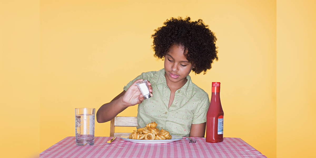 Copy of Untitled (1200 × 600 px) (9) Excess salt consumption during childhood can lead to cravings for salty food as adults and cause hypertension. (Wikimedia Common)