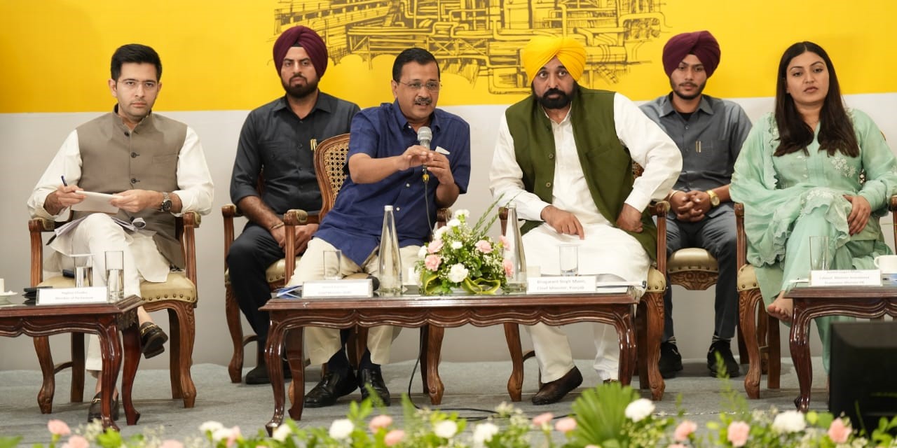 Punjab CM Mann and Delhi CM Kejriwal along with other officials. (Supplied) Bhagawant Mann meeting industrialists