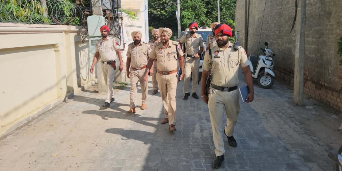 Punjab police officials during the raid. Punjab gangsters raid
