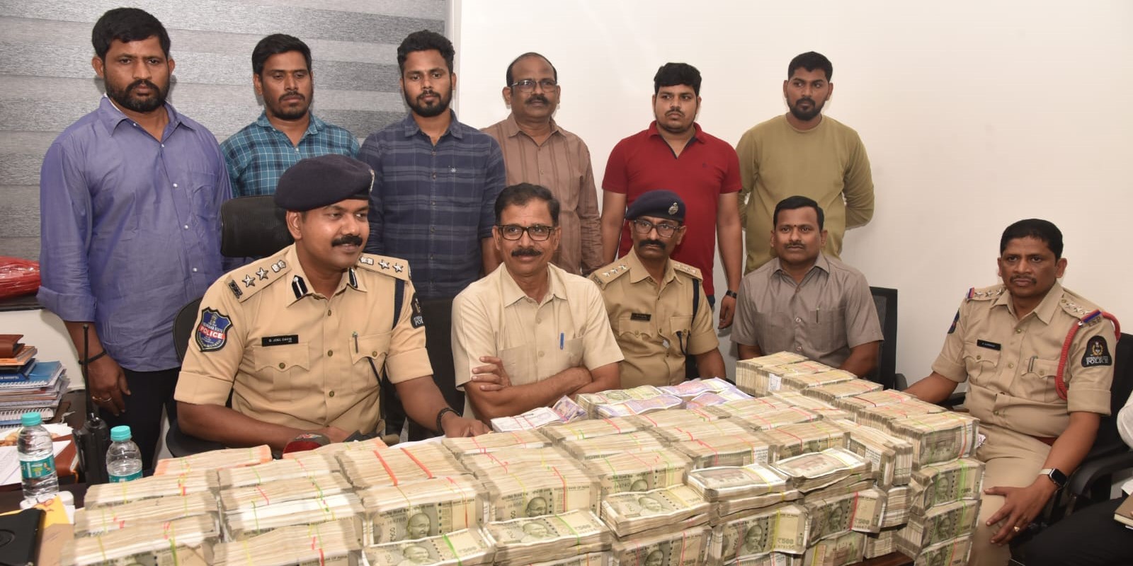 Police with the seized cash. (Supplied) Hyderabad police seize ₹3.35 crore of unaccounted money; ₹88 lakh seized in Narsingi