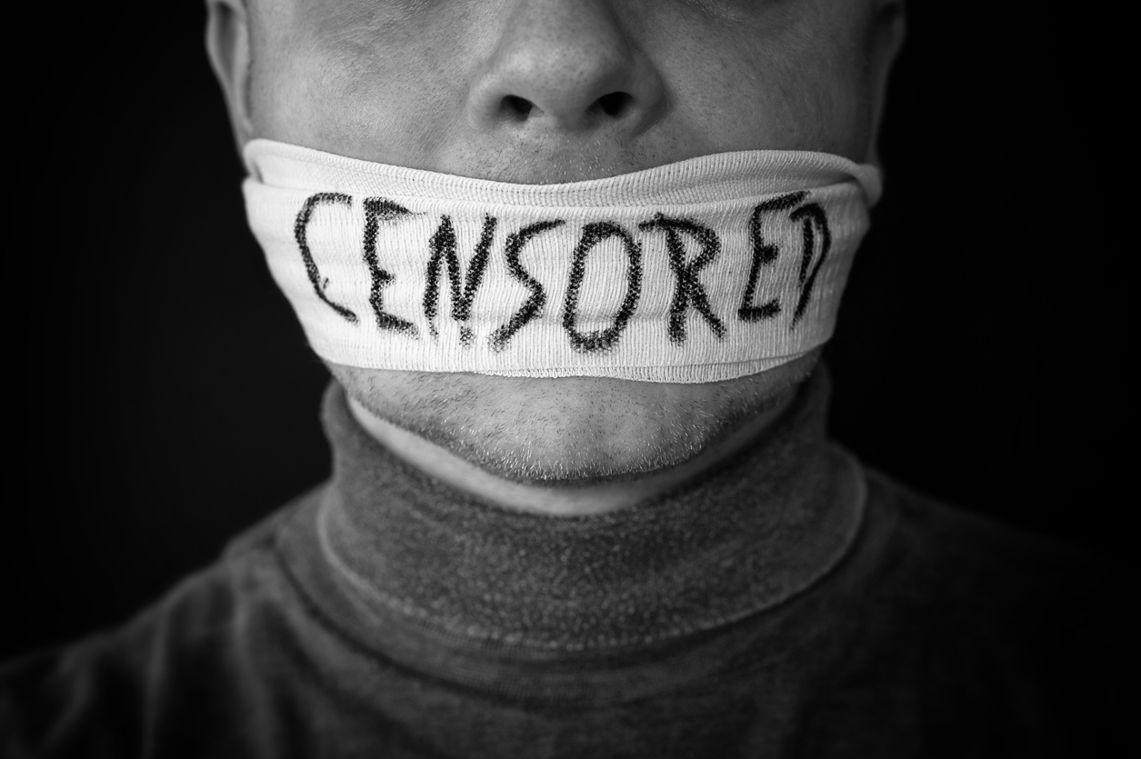 Bandaged mouth of a man with the word censored in English Broadcast regulation