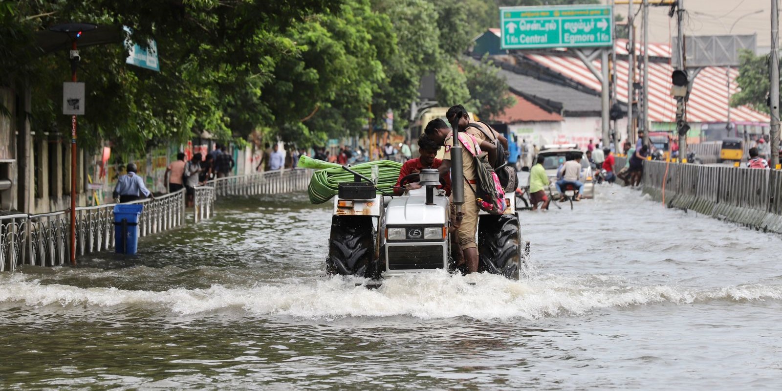 Policemen riding a tractor to wade through the flooded roads in Chennai. (Supplied) Chennai rains