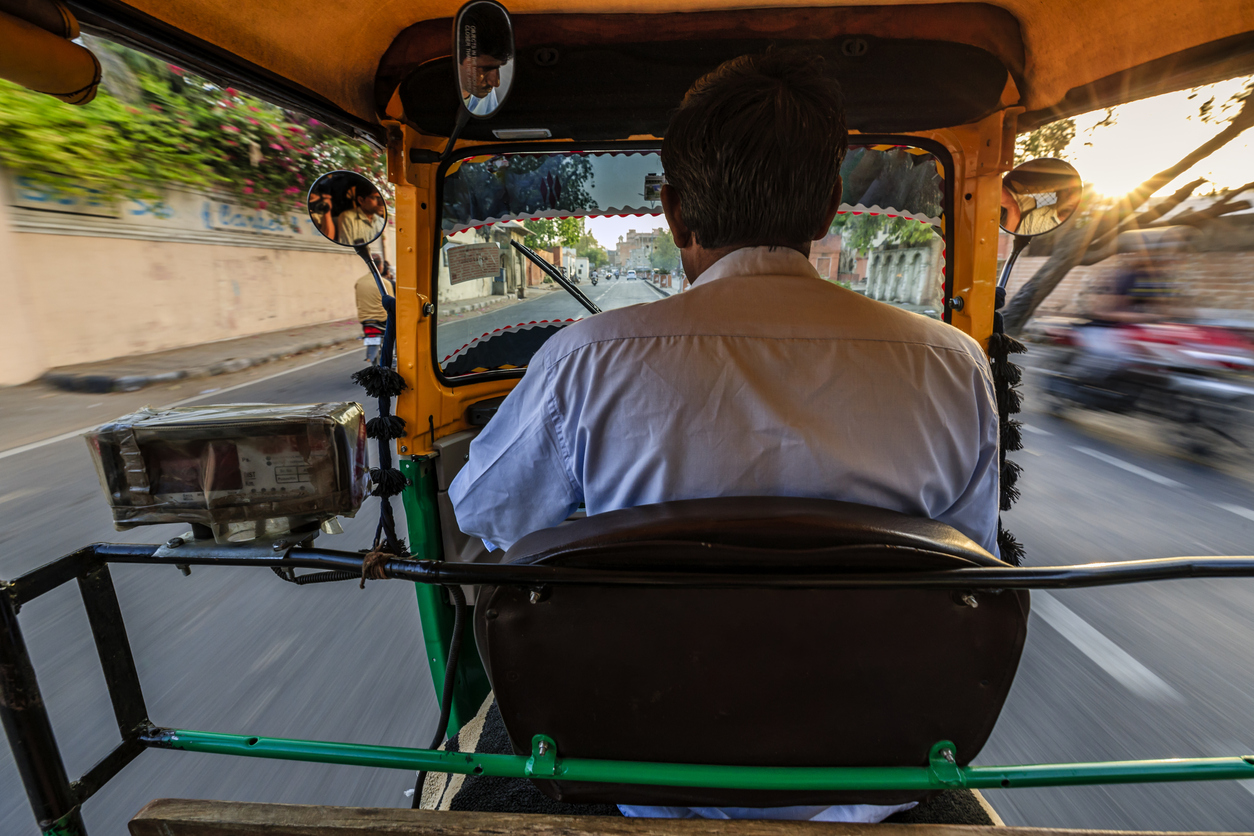 Indian man drives auto rickshaw (tuk-tuk), India Hyderabad auto drivers