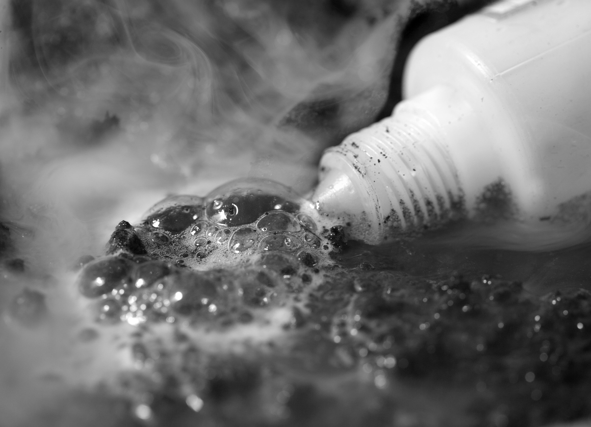 Plastic bottle with spilled acid Acid attack