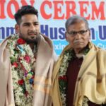 Mohammed Hussamuddin being felicitated with his father and first coach Mohammed Shamshuddin. (Supplied)