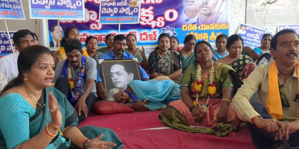 Srinu's mother and elder brother with Sainik Dal members in Vijayawada. (South First)