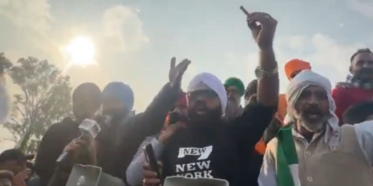 Protesting farmers holding a bullet claiming that Haryana police fired bullets at them. (Screengrab) Farmers protest