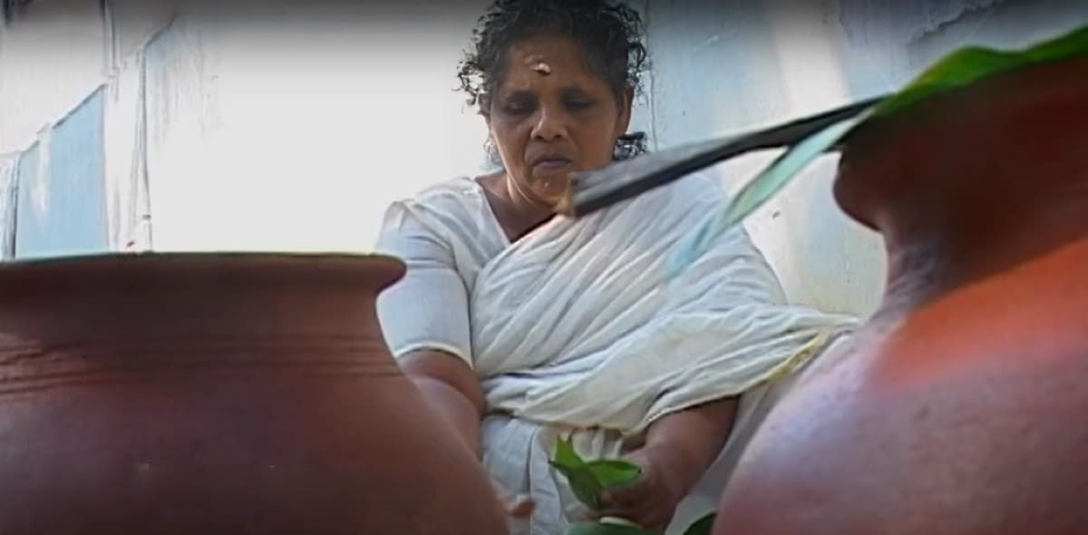 Woman celebrating Attukal Pongala