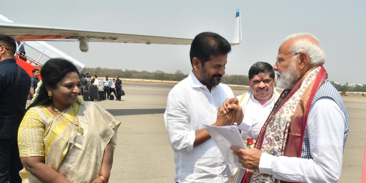 Revanth with PM Modi Telangana Chief Minister A Revanth Reddy with Prime Minister Narendra Modi in Telangana on Monday, 4 March, 2024, as Governor Tamilisai Soundararajan looks on.