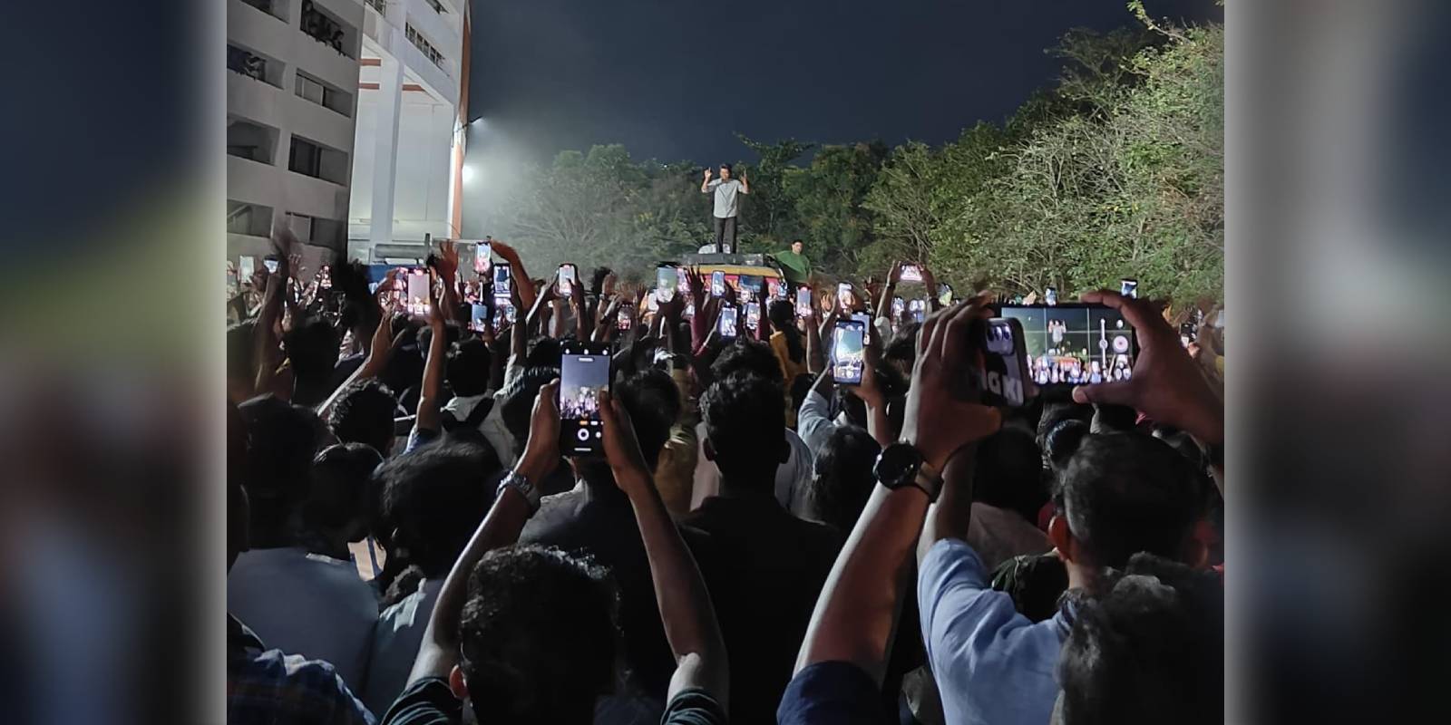 Vijay greets his fans in Kerala from GOAT shooting location Vijay greets his fans in Kerala from GOAT shooting location