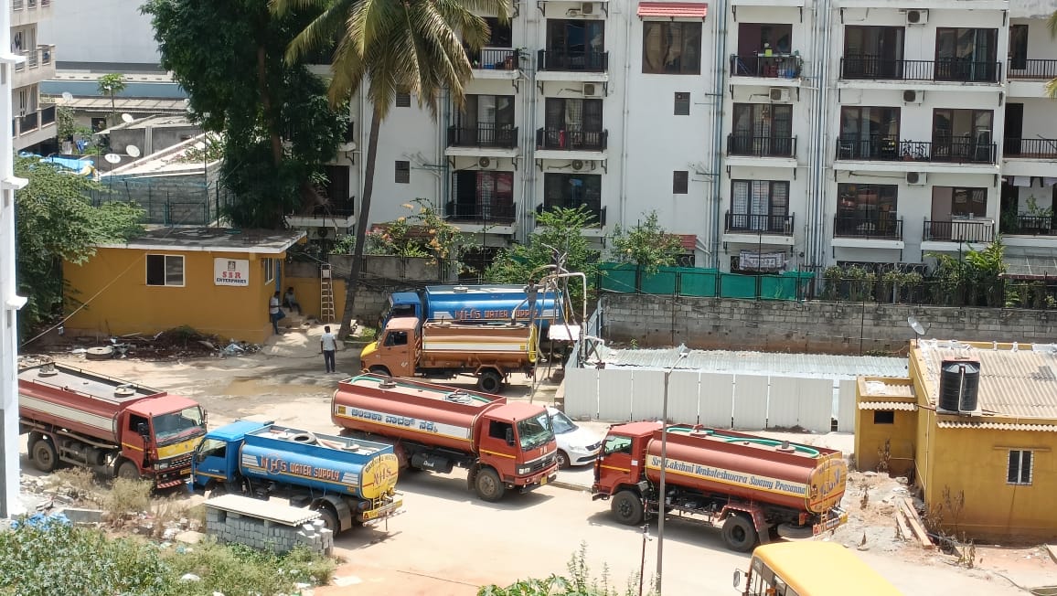 Water tankers waiting at a borewell point to fill and supply water in Bengaluru Water tankers waiting at a borewell point to fill and supply water in Bengaluru