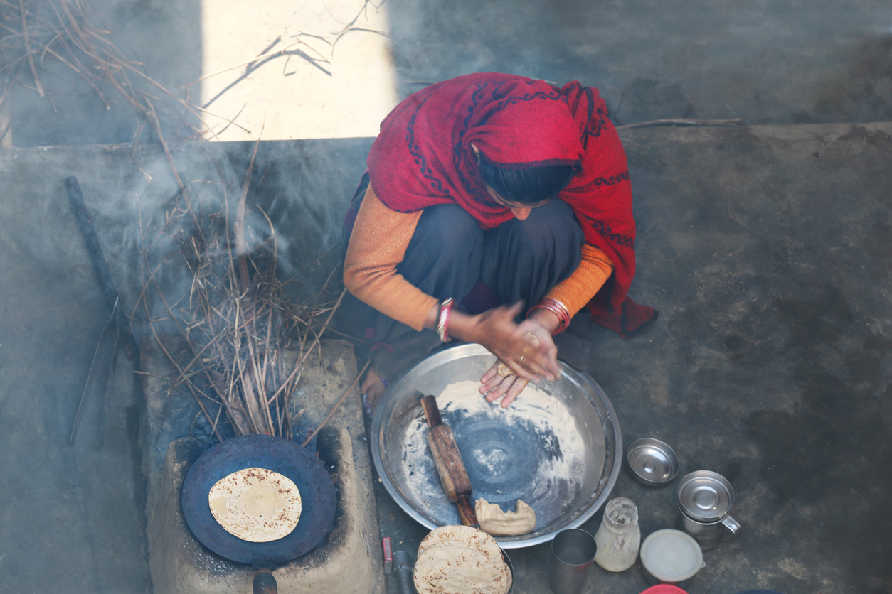 Woman cooking at home. (iStock)