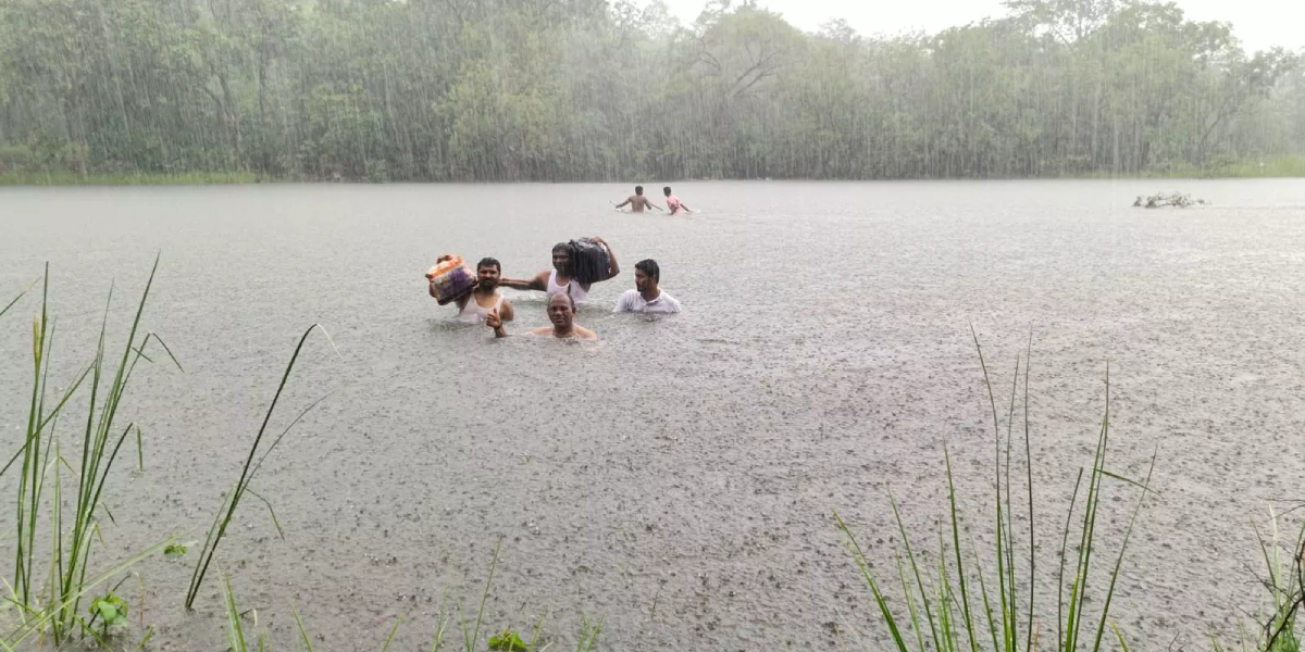 Mulugu DMHO crosses flowing stream to reach patients Mulugu medical officer