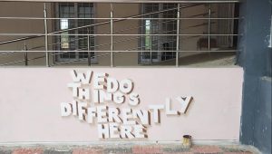 A painting on the walls of EMRS Kalwakurthy stating "We do things differently here"