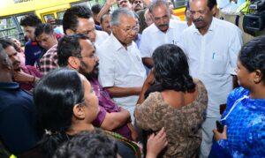 Chief Minister Pinarayi Vijayan consoling a survivor
