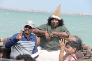 Director Chimbu Deven with Yogi Babu on the film sets