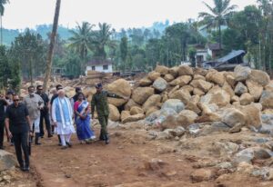 Prime Minister Narendra Modi with officials at Chooralmala.