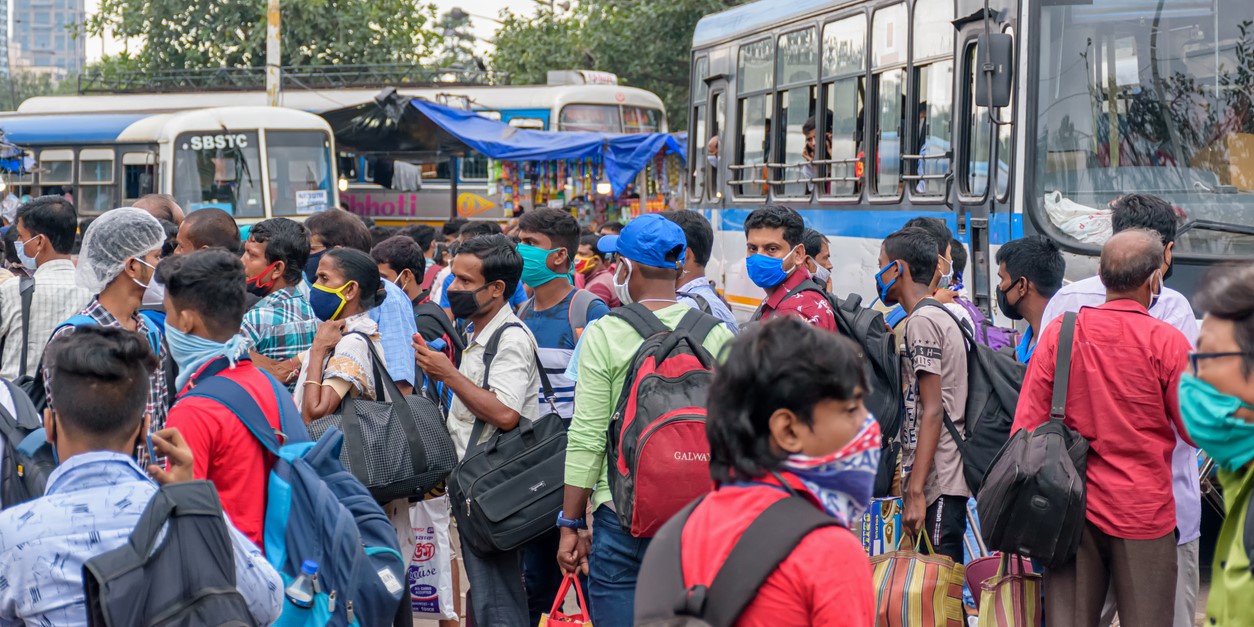Migrant workers at a bus station during the Covid-19 pandemic.