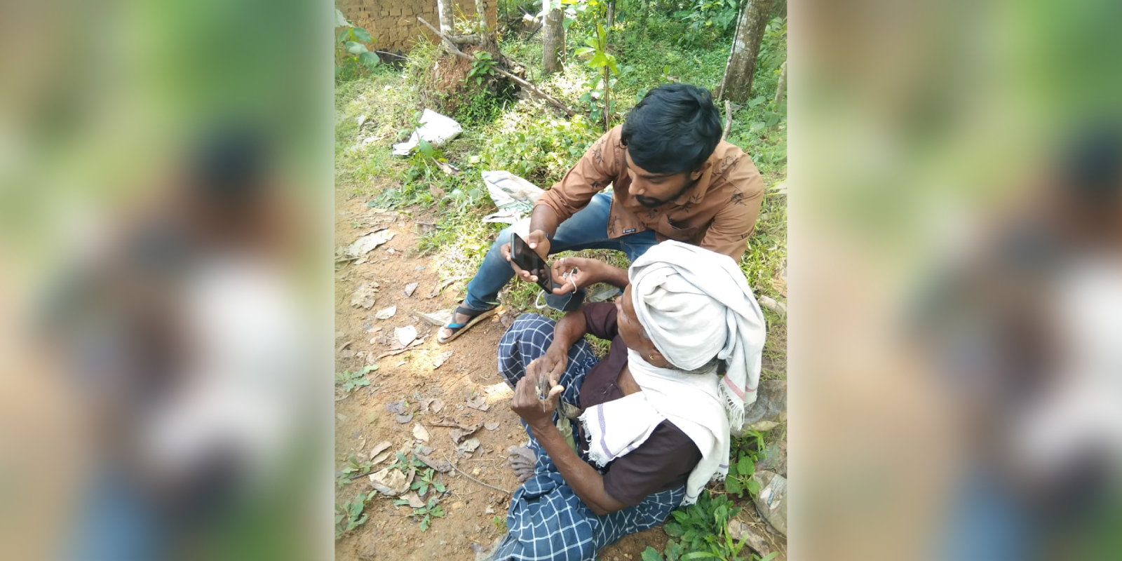 A digital volunteer providing training to a senior citizen