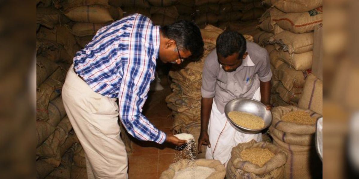 An official inspecting the rice in a ration shop in Tamil Nadu. (Supplied)