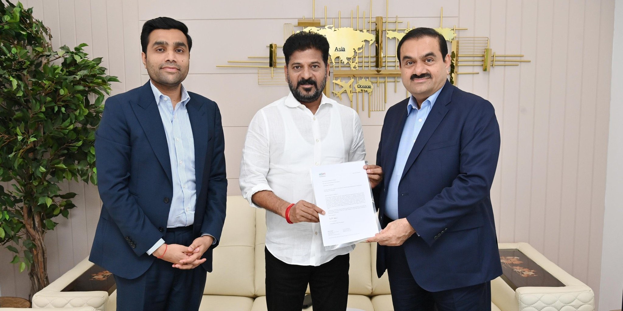 Revanth Reddy with Gautam Adani and Karan Adani. (X) Revanth Reddy with Gautam Adani and Karan Adani. (X)