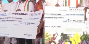 Chief Minister Revanth Reddy handing over cheques for the schemes