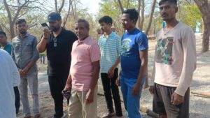 Jeetu Sahu (fourth, right) reached Domapenta from Jharkhand's Gumla district in search of his son Sandeep Sahu. (Sumit Jha/South First)