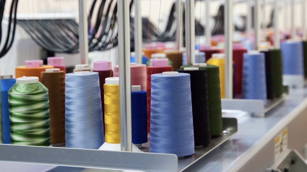 Colorful reels of threads background Tamil Nadu Budget 2025: Textile industry demands policy safeguard amidst growing challenges