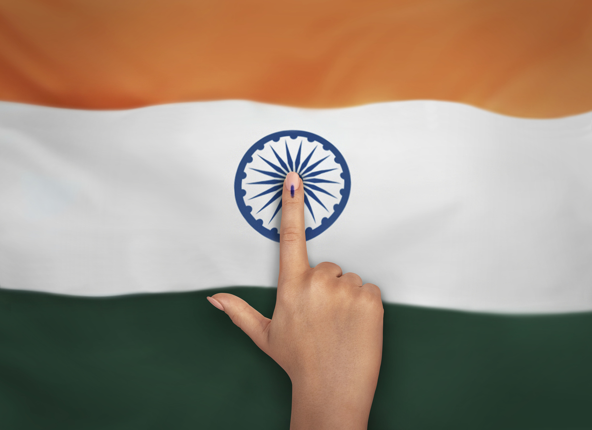 female Indian Voter Hand with voting sign or ink pointing vote for India on india flag background commission of India Delimitation