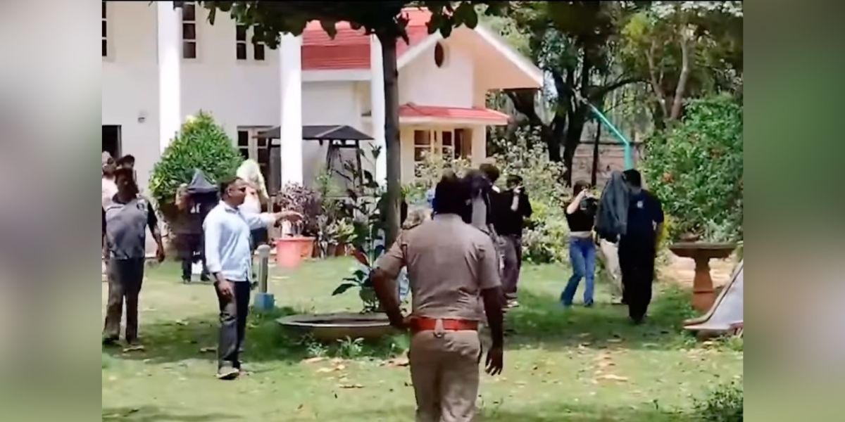 Police detaining the accused. Bengaluru rave party