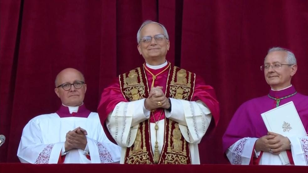 Pope Leo XIV (centre) made his first appearance before the gathered faithful, blessing the crowds from the central window of St. Peter’s Basilica.