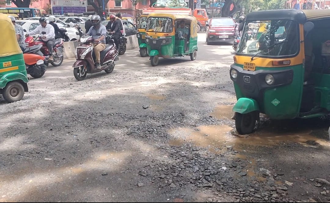 Bengaluru_Road From the bustling streets of Rajajinagar to the tech corridors of Whitefield, commuters across Bengaluru are navigating roads riddled with potholes and long-standing neglect.