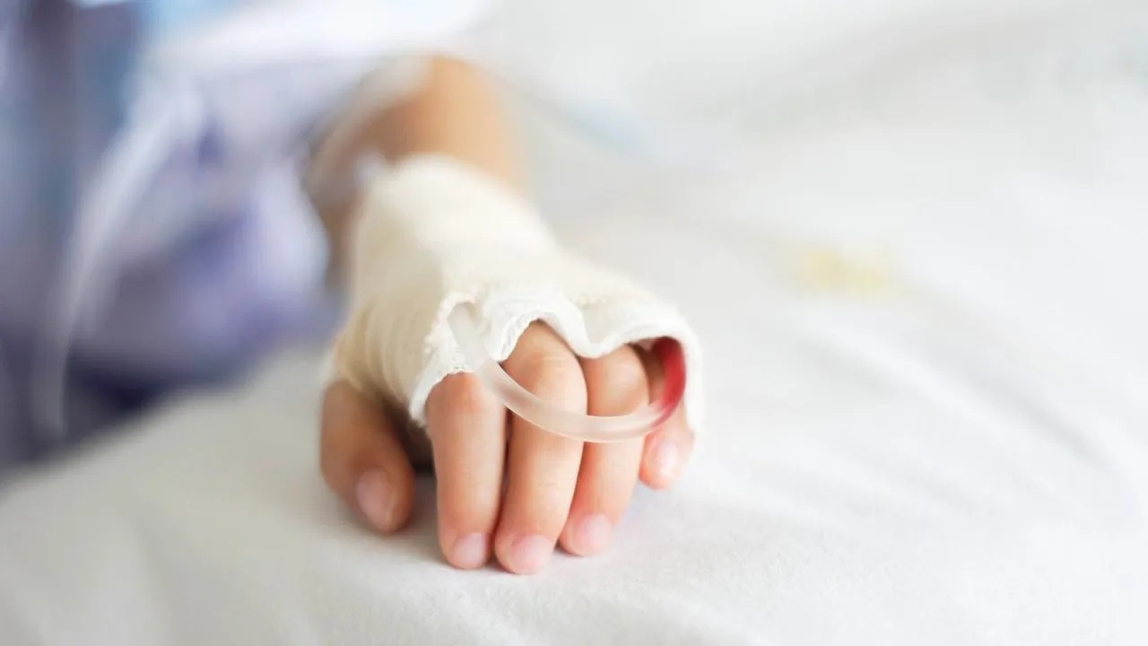 A-child-in-a-hospital Prescribing expensive treatment for financially stressed patients could affect the entire family.