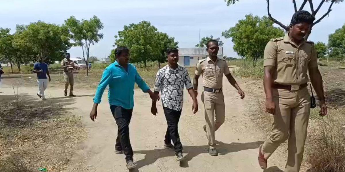 Police escorting injured workers out of the fireworks unit in Sivakasi.
