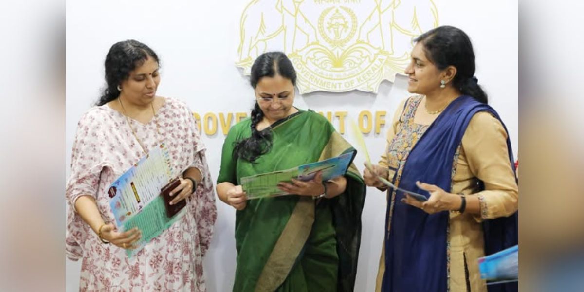 WCD and Health Minister Veena George having a look at the Kunjus Card.